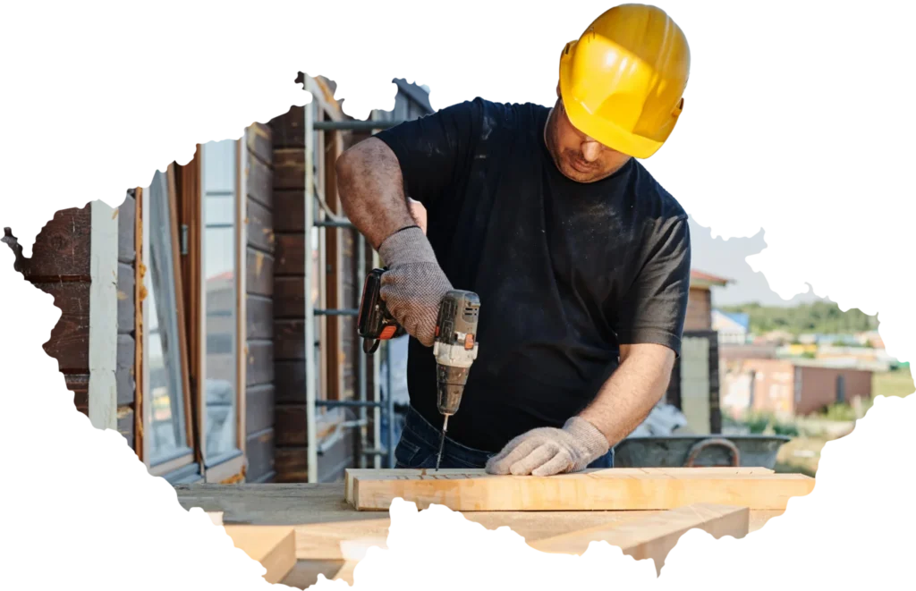 pracovník pri práci s drevom